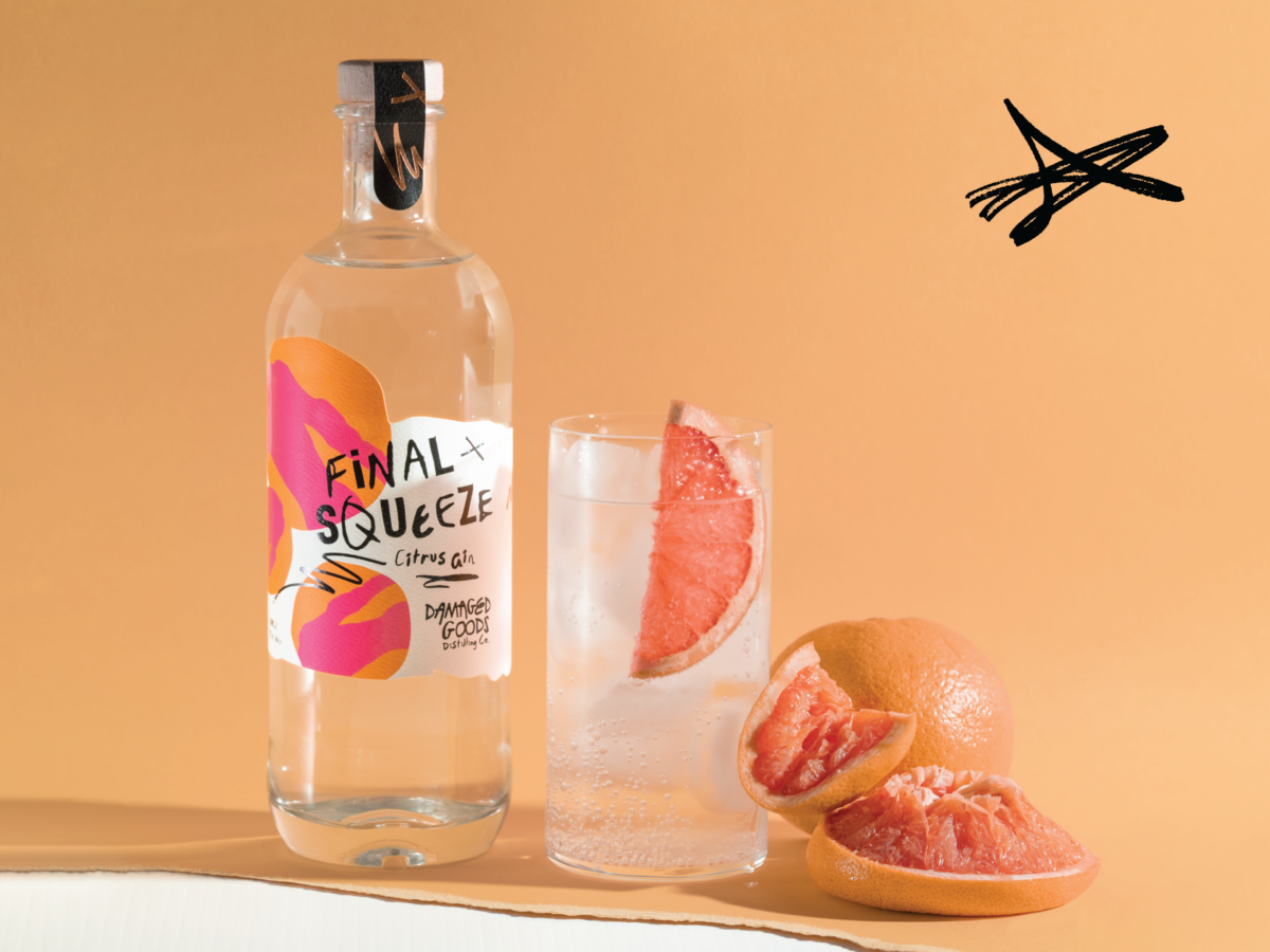 Damaged Goods distilling company bottle and glass of Final Squeeze citrus gin